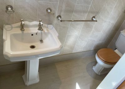 New bathroom tiling and installation of basin and pedestal