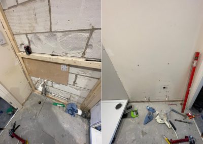 Water pipes and wooden battens on bare plaster, ready to receive new tiles