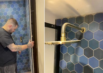 Contractor removing an old tiled shower cubicle