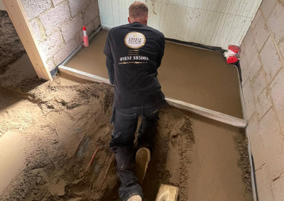 Floor screed contractor installing underfloor heating screed at a new build in northampton